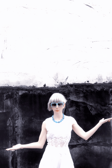 An animated personal-style portrait against a black and white wall