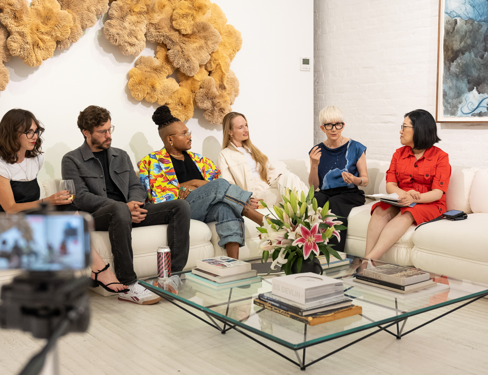 Jasmin Malik Chua moderating the Is This a Luxury Item panel with Katya Moorman and the complete group of panelists at Another Tomorrow
