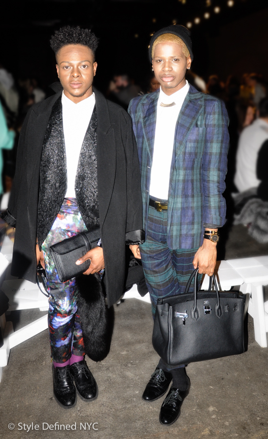 Two men in sharply contrasting tailored looks at a New York fashion event