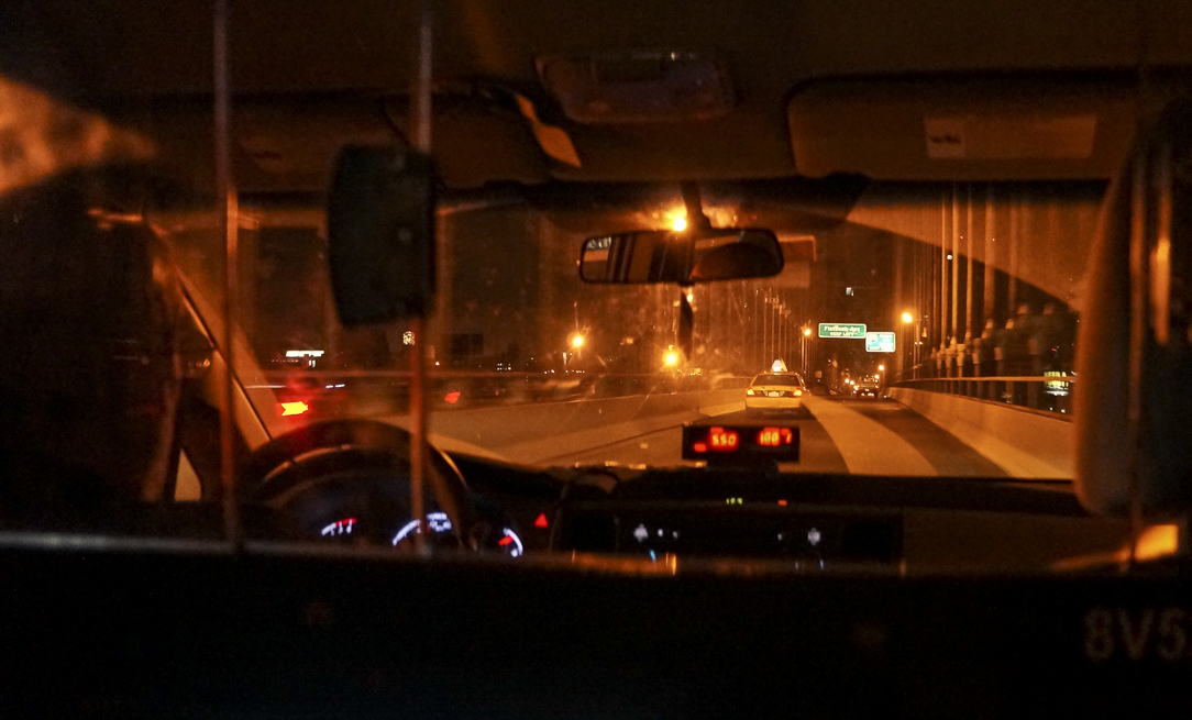 The view through a New York taxi windshield late at night